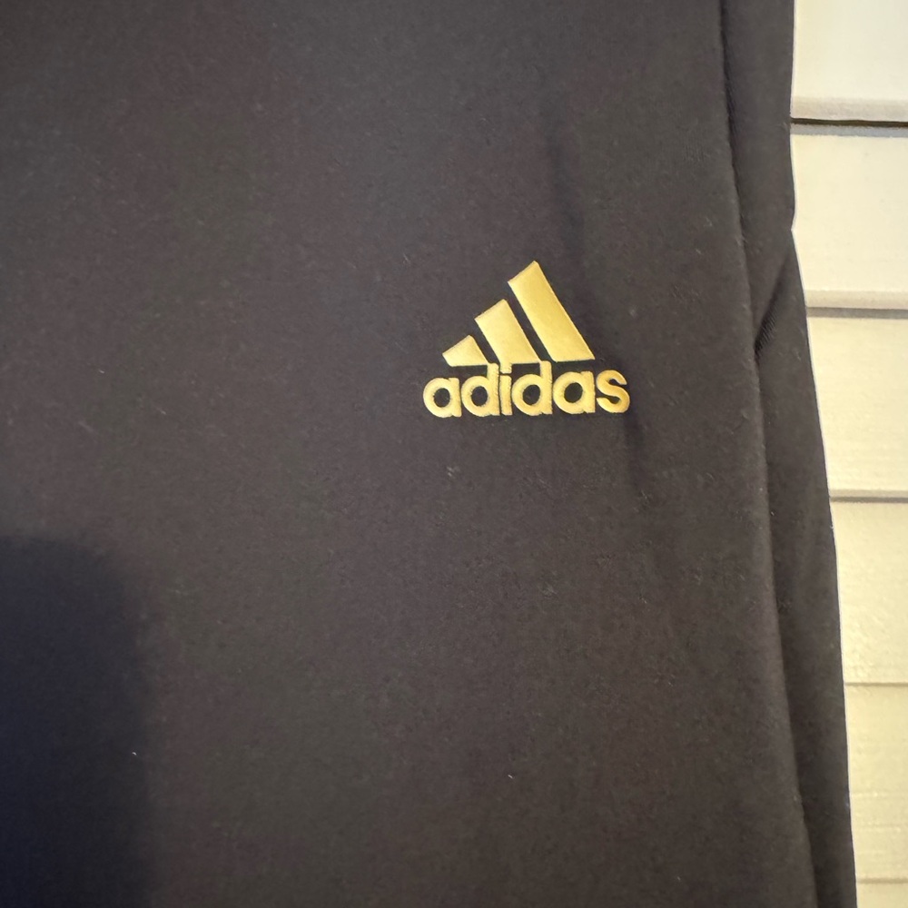 Adidas Black pants with Gold Emblem